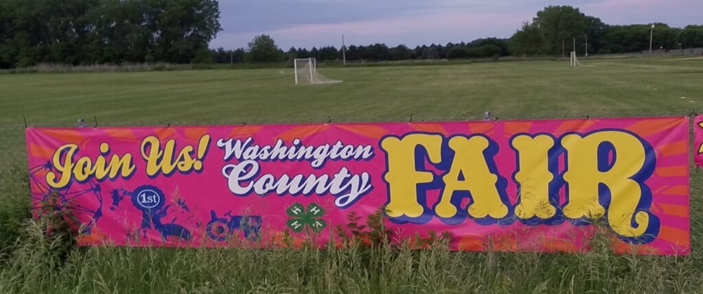 washington county fair banner in a field